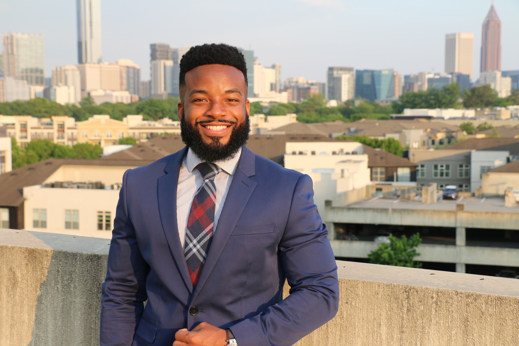Brian Dunams with the Atlanta skyline behind him